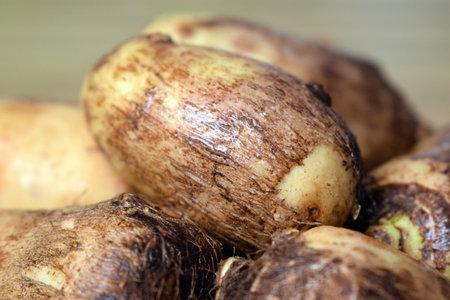 Group Of Taro Root Vegetable On Wooden Table Close Up  Imageの写真素材