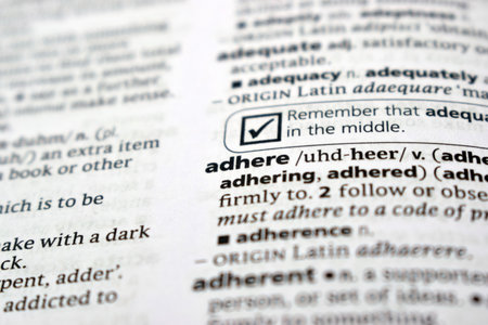 English Definition Dictionary Of Printed Word -  Adhere  Close Up     Imageの写真素材
