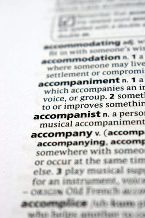 Close Up Of English Dictionary Page With Definition Word - Accompanist     Image