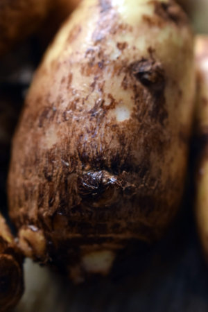 Group Of Unpeeled Taro Root Vegetable On Wooden Table  Image