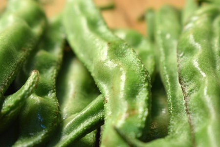 Group Of Fresh Hyacinth Bean or Same Ki Phalli On Wooden Table Close Up With Background Blur  Imageの写真素材