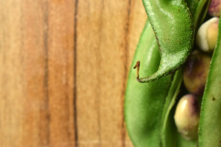 Group Of Fresh Hyacinth Bean or Same Ki Phalli On Wooden Table Close Up With Background Blur  Imageの写真素材