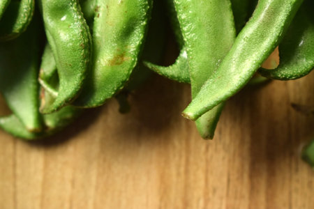 Group Of Fresh Hyacinth Bean or Same Ki Phalli On Wooden Table Close Up With Background Blur  Image