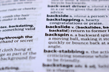 Close Up Of English Dictionary Page With Definition Word - Backslide     Imageの写真素材