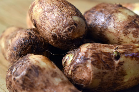Group Of Taro Root Vegetable On Wooden Table Close Up  Imageの写真素材