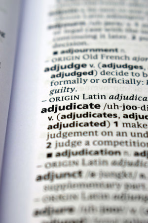 Close Up Of English Dictionary Page With Definition Word -    Adjudicate  Imageの写真素材