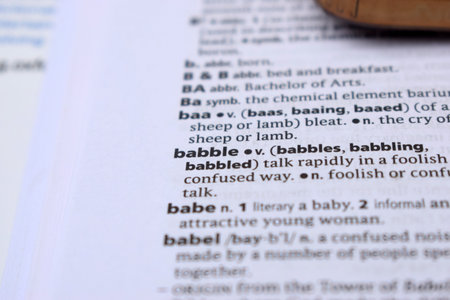 Close Up Of English Dictionary Page With Definition Word -     Babble  Image