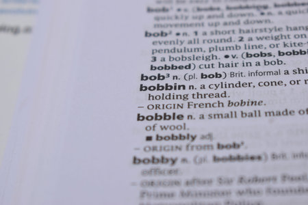 English Definition Dictionary Page Of Printed Word -Bobbin   Close Up Image