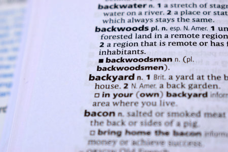 Close Up Of English Dictionary Page With Definition Word -Backyard    Image