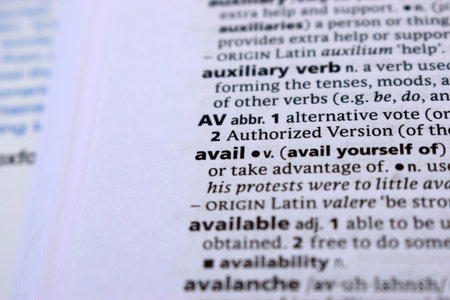 Close Up Of English Dictionary Page With Definition Word -Avail      Image