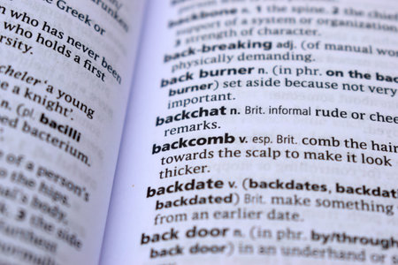 Close Up Of English Dictionary Page With Definition Word -  Backcomb  Image