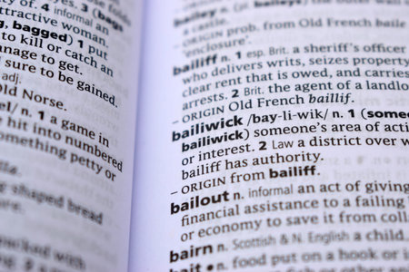 Close Up Of English Dictionary Page With Definition Word -   Bailout Image