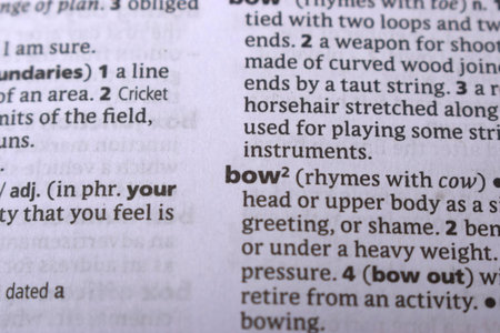 Close Up Of English Dictionary Page With Word - Bow