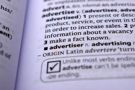 Close Up Of English Dictionary Page With Word - Advertiserの写真素材