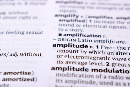 Close Up Of English Dictionary Page With Word - amplitude