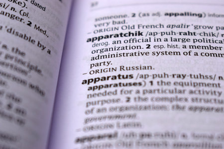 English Definition Dictionary Page Close Up Of Printed Word Of -apparatchik