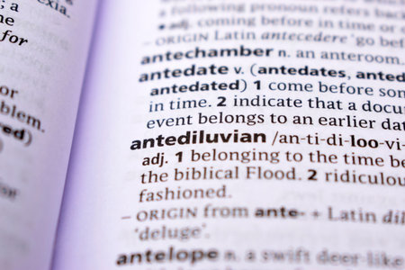 Close Up Of English Dictionary Page With Word - antediluvianの写真素材