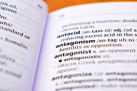 Close Up Of English Dictionary Page With Word - antagonismの写真素材