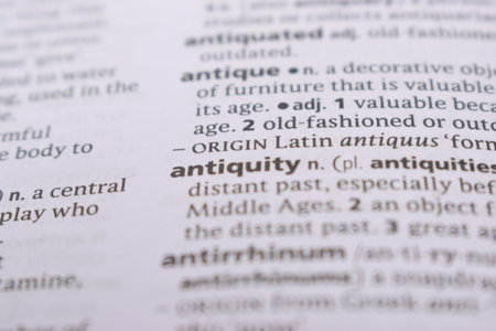 Close Up Of English Dictionary Page With Word - antiquity