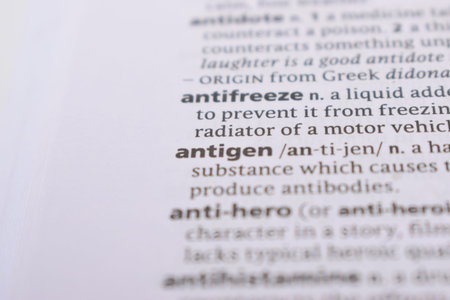 Close Up Of English Dictionary Page With Word - antigen
