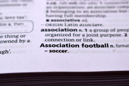 Close Up Of English Dictionary Page With Word - Association footballの写真素材