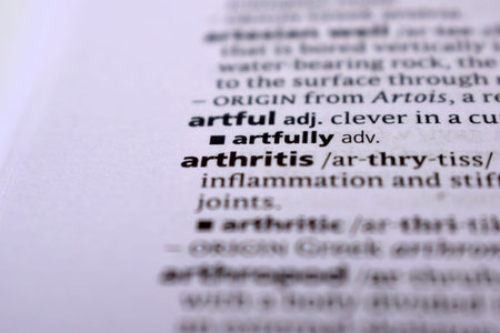 Close Up Of English Dictionary Page With Word - arthritis