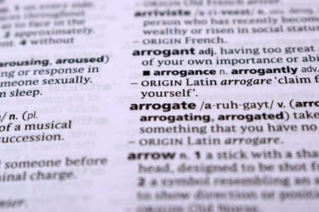 Close Up Of English Dictionary Page With Word - arrogateの写真素材
