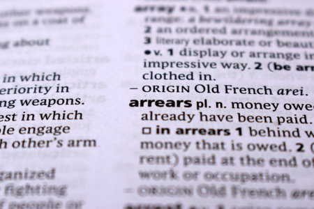 Close Up Of English Dictionary Page With Word - arrearsの写真素材