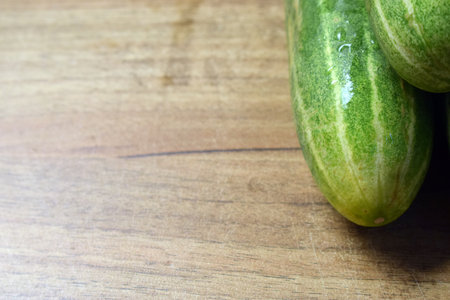 fresh green cucumber on table close upの写真素材