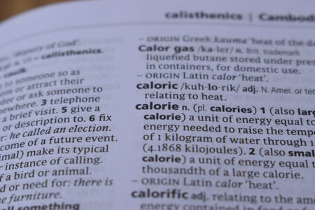 Definition Of English Dictionary Close Up Of Page Print With Word - calorie
