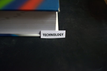Technology Paper Tab Inserted in Book Pages Symbolizing Modern Advancements