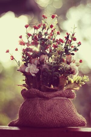 Still life with a beautiful bunch of flowers, vintage color tone.の写真素材