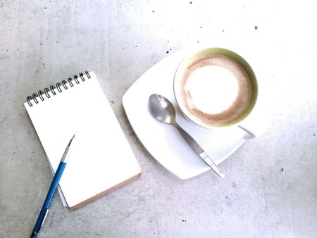 Top view of a working desk in a coffee shopの素材