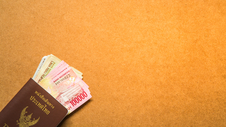 Thailand passport with money for travelの写真素材
