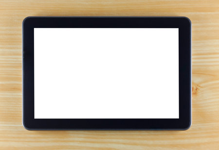 Black tablet computer on wooden background