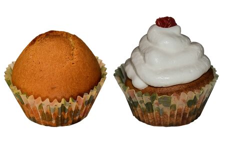 Two cupcakes - before and after decorating with cream and dry cherry isolatedの写真素材