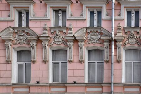 Baroque style old wall with windows in pink colorの写真素材