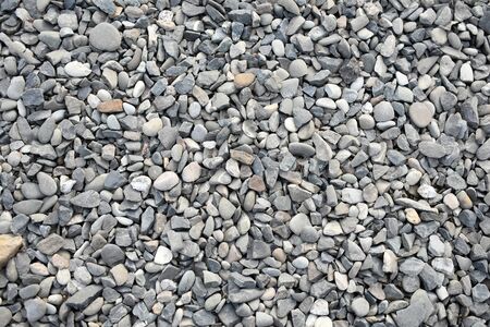 Gravel background with small and medium size stones various colorsの写真素材