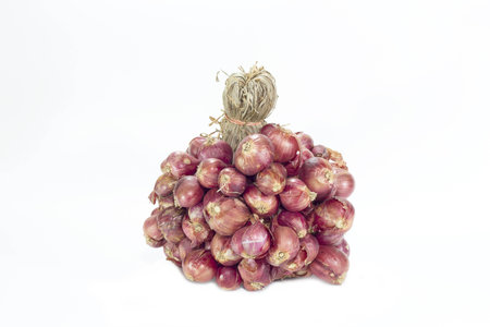 Group of small red shallot onions  on white background