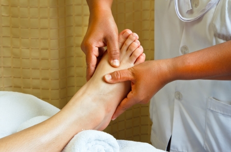 reflexology foot massage, spa foot treatment.の写真素材