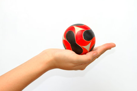 woman hand giveing  a ball in  isolated background,woman hand handle a ball