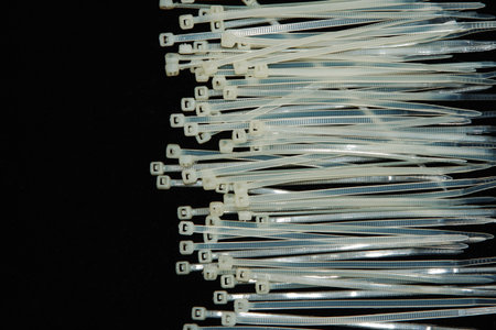 pie of nylon cable ties on black background
