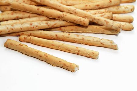 crispy sticks with sesame on napkin isolated on white backgroundの写真素材