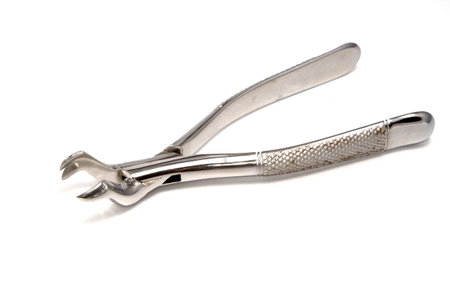 Dental extraction forceps on white background
