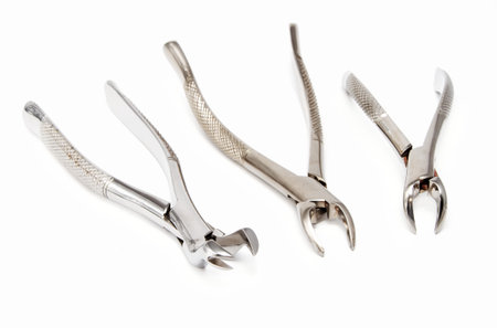 Dental extraction forceps on white background