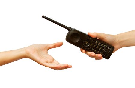 woman hand giving a phone , isolated on white backgroundの写真素材