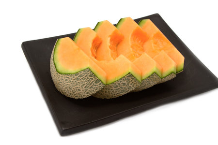 melon slices on black backgroundの写真素材