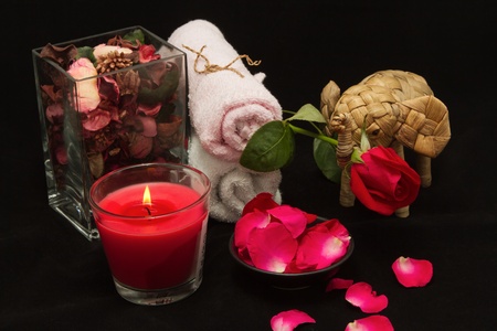 Spa red rose setting with thai incense and candlelightの写真素材