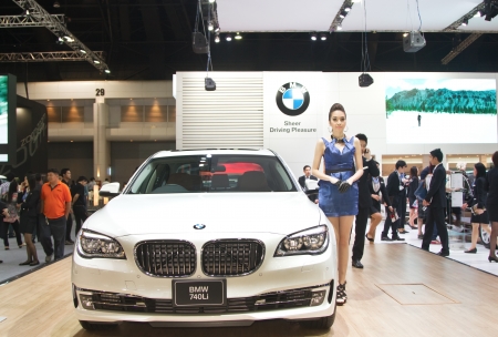 BANGKOK, THAILAND- DECEMBER 8 : Unidentified female presenter with BMW 740Li on display at The 29th Thailand International Motor Expo 2012 at Impact on December 8, 2012 in Bangkok,Thailandのeditorial素材