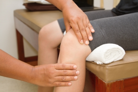 Doctor checking the knee jointの写真素材